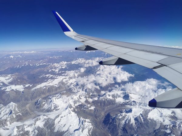 Plane and snowy mountains
